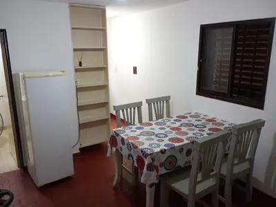 a dining room with a table and chairs and a window at El Dpto de Gabicito II in Cordoba