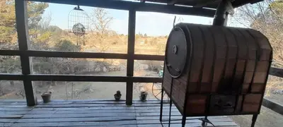 a large window with a view of a bird cage at Cabaña Waicol EXCLUSIVA in Potrero de Garay