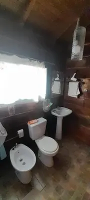 a bathroom with two toilets and a sink at Cabaña Waicol EXCLUSIVA in Potrero de Garay