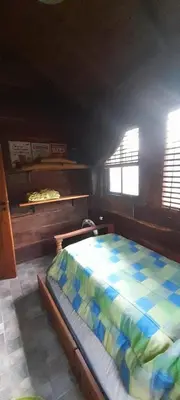 a bedroom with a bed in a room at Cabaña Waicol EXCLUSIVA in Potrero de Garay