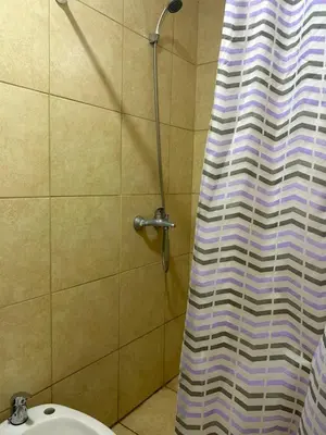 a shower curtain in a bathroom with a sink at Depto1 in Río Cuarto