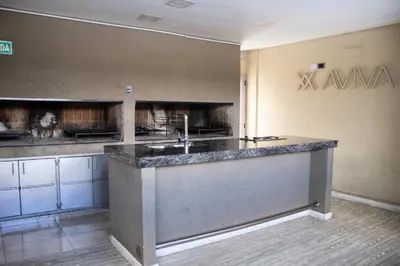 a large kitchen with a sink in a room at IBBA - Departamento en Nueva Cordoba con pileta in Cordoba