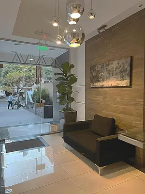a living room with a couch and a table at IBBA - Departamento en Nueva Cordoba con pileta in Cordoba