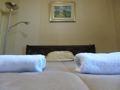 a bedroom with two beds with towels on them at Córdoba Centro Gran Ubicación Gran Vista in Cordoba