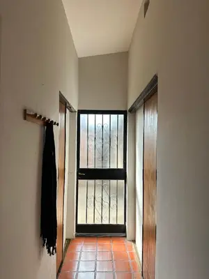 an empty hallway with a large window in a room at Casa López en el centro de Santa Rosa de Calamuchita in Santa Rosa de Calamuchita