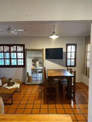 a living room with a wooden table and a couch at Casa López en el centro de Santa Rosa de Calamuchita in Santa Rosa de Calamuchita