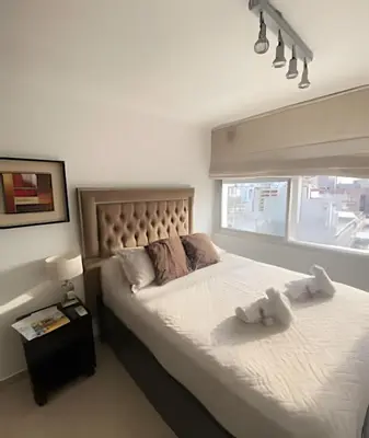 a bedroom with a large bed and a window at Apartament vista Buen pastor in Cordoba