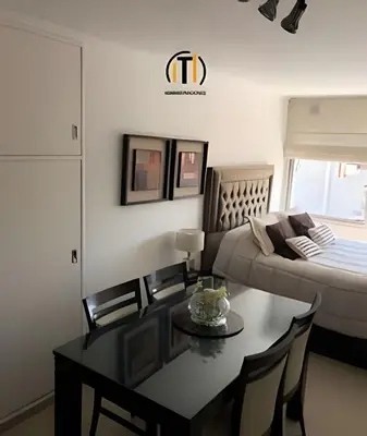 a living room with a couch and a table at Apartament vista Buen pastor in Cordoba