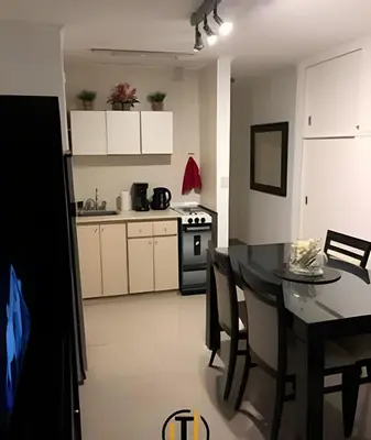 a kitchen and dining room with a table and chairs at Apartament vista Buen pastor in Cordoba