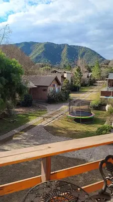 a view of a yard with a playground at Las Lechuzas Complejo in Santa Rosa de Calamuchita