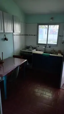 a kitchen with a stove and a sink and a window at Casa Icho Cruz in Villa Icho Cruz