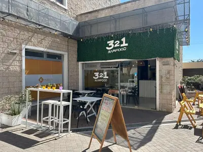 a restaurant with a table and chairs outside of it at Excepcional departamento en Piso 18 en zona norte de Córdoba capital con una vista inigualable en barrio privado Alto Villa Sol in Cordoba