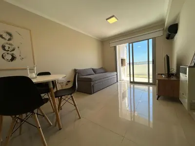 a living room with a couch and a table at Excepcional departamento en Piso 18 en zona norte de Córdoba capital con una vista inigualable en barrio privado Alto Villa Sol in Cordoba