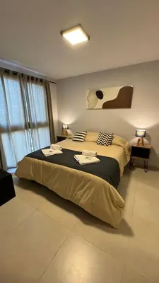a bedroom with a large bed in a room at Guesthouse Park in Cordoba