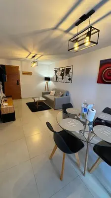 a living room with a couch and a table and chairs at Guesthouse Park in Cordoba