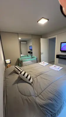 a bedroom with a large bed and a television at Guesthouse Park in Cordoba
