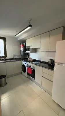 a kitchen with a stove and a dishwasher in it at Guesthouse Park in Cordoba