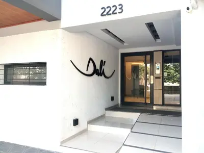 a facade of a building with a sign on it at Depto 1 dormitorio totalmente equipado in Cordoba