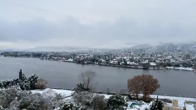 a snowy view of a city and a lake at Shakespeare 176 Ph3 in Villa Carlos Paz