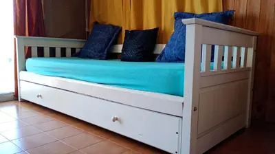 a bed with blue sheets and blue pillows on it at Shakespeare 176 Ph3 in Villa Carlos Paz