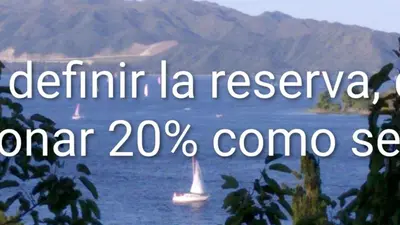 a view of a lake with a boat in the water at Shakespeare 176 Ph3 in Villa Carlos Paz