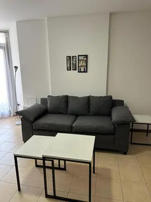 a living room with a couch and a table at Departamento Remodelado en Nva in Cordoba