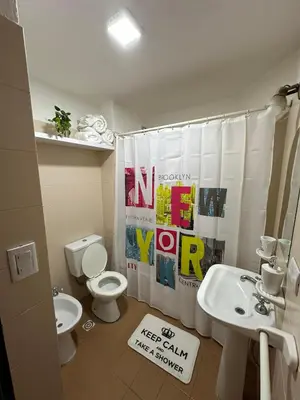 a bathroom with a toilet and a sink at Departamento Remodelado en Nva in Cordoba