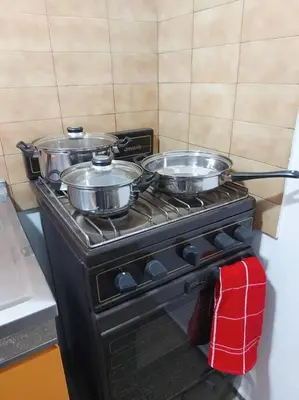 two pots on top of a stove in a kitchen at Microcentro de la Docta in Cordoba