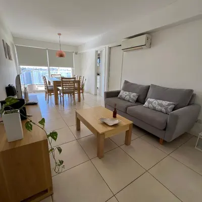a living room with a couch and a table at Confort y seguridad in Cordoba