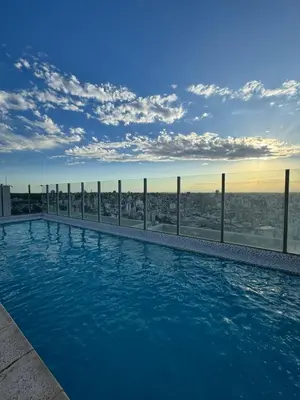 a swimming pool on top of a building with a view at Confort y seguridad in Cordoba