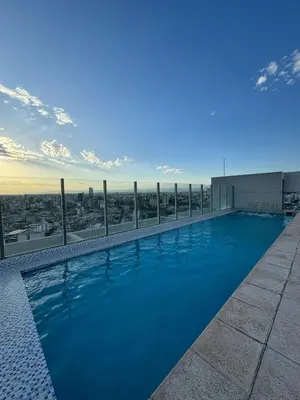 a swimming pool on the roof of a building at Confort y seguridad in Cordoba