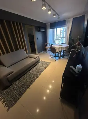 a living room with a couch and a table at Depto Villa Sol in Cordoba