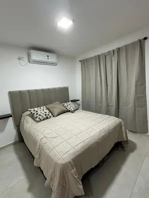a bedroom with a bed in a room with a window at Departamento en calle Obispo Trejo NVA CBA in Cordoba