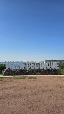 a sign that says villeller blue in a field at El paraiso in Villa del Dique