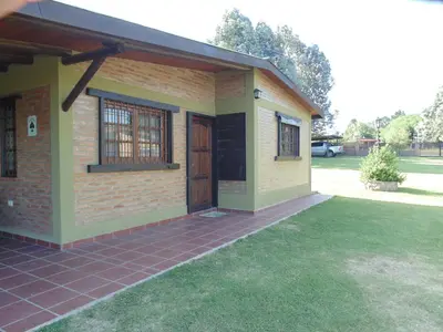 a small house with a porch and a door at Cabañas los amigos Chañar in Potrero de Garay