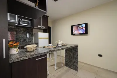 a kitchen with a counter top in a room at Complejo Solares in Alta Gracia