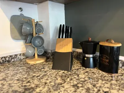 a kitchen counter with knives and utensils on it at Aguaribay duplex Nuevo Centro in Cordoba