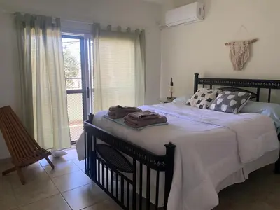 a bedroom with a bed with towels on it at Departamento Confortable 2 in Cordoba