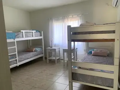 a room with two bunk beds and a window at Departamento Confortable 2 in Cordoba