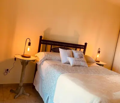a bedroom with a bed with two pillows on it at Departamento Confortable 2 in Cordoba