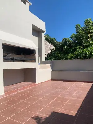 a brick walkway in front of a white building at Departamento Confortable 2 in Cordoba