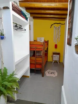a hallway of a house with a yellow wall at Cabañas Lauquen Villa Carlos Paz in Villa Carlos Paz