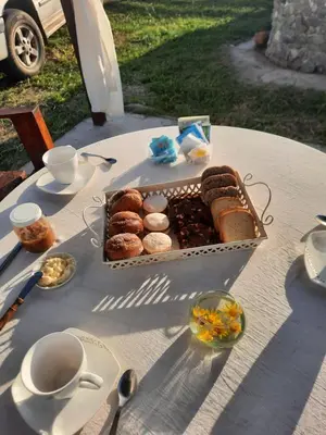 a table with a box of donuts on it at Cabaña Emmanuel in Santa Rosa de Calamuchita