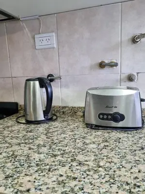 a toaster sitting on a counter in a kitchen at Hermoso y cómodo Dpto en el centro in Cordoba