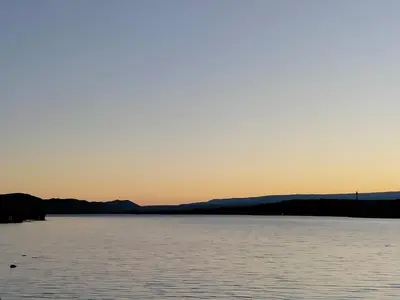 a view of a large body of water at sunset at Guemes270 in San Roque