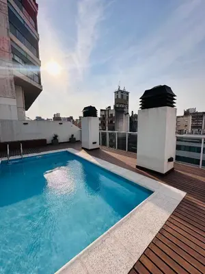 a swimming pool on the roof of a building at CATEGORIA departamento a dos cuadras del patio olmos 1 dormitorio asador pileta y cochera in Cordoba
