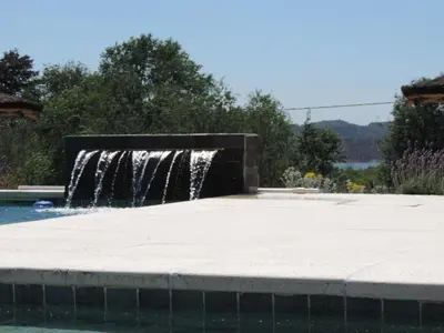 a water fountain in the middle of a patio at Cabañas Aires de Montaña in La Estancia