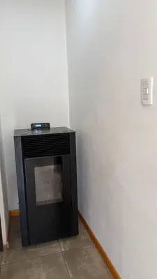 a black television sitting in a corner of a room at Luz del Rincón in Merlo