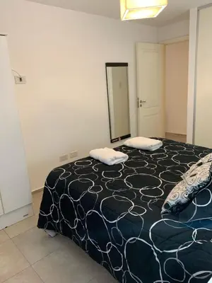 a bedroom with a bed with two pillows on it at Hermoso departamento amoblado ubicado en pleno Nueva Córdoba in Cordoba