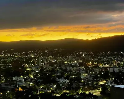 a view of a city at sunset at Amanecer Serrano Carlos Paz in Villa Carlos Paz